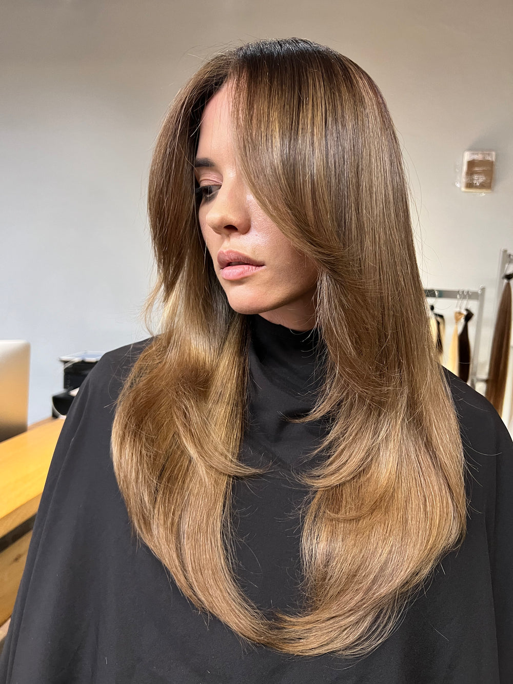 Long brown hair with caramel balayage and face-framing layers
