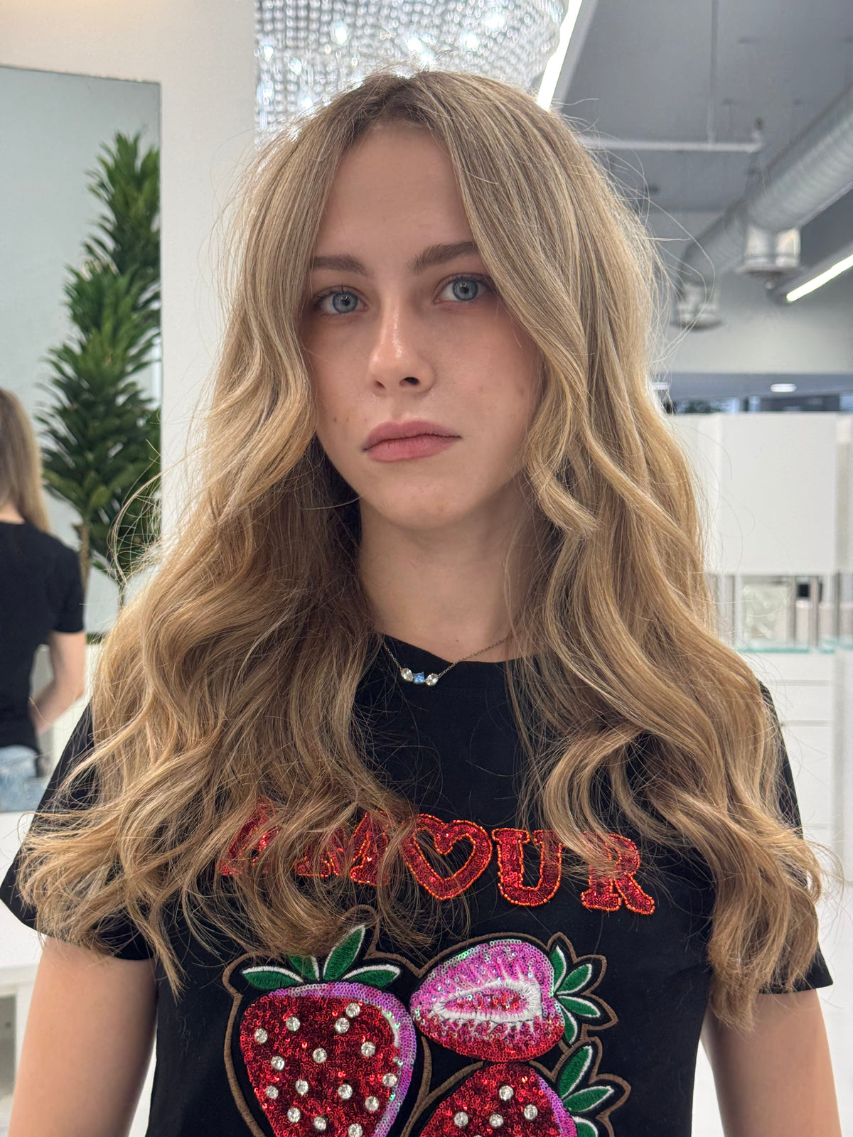 Long honey blonde waves with face-framing layers