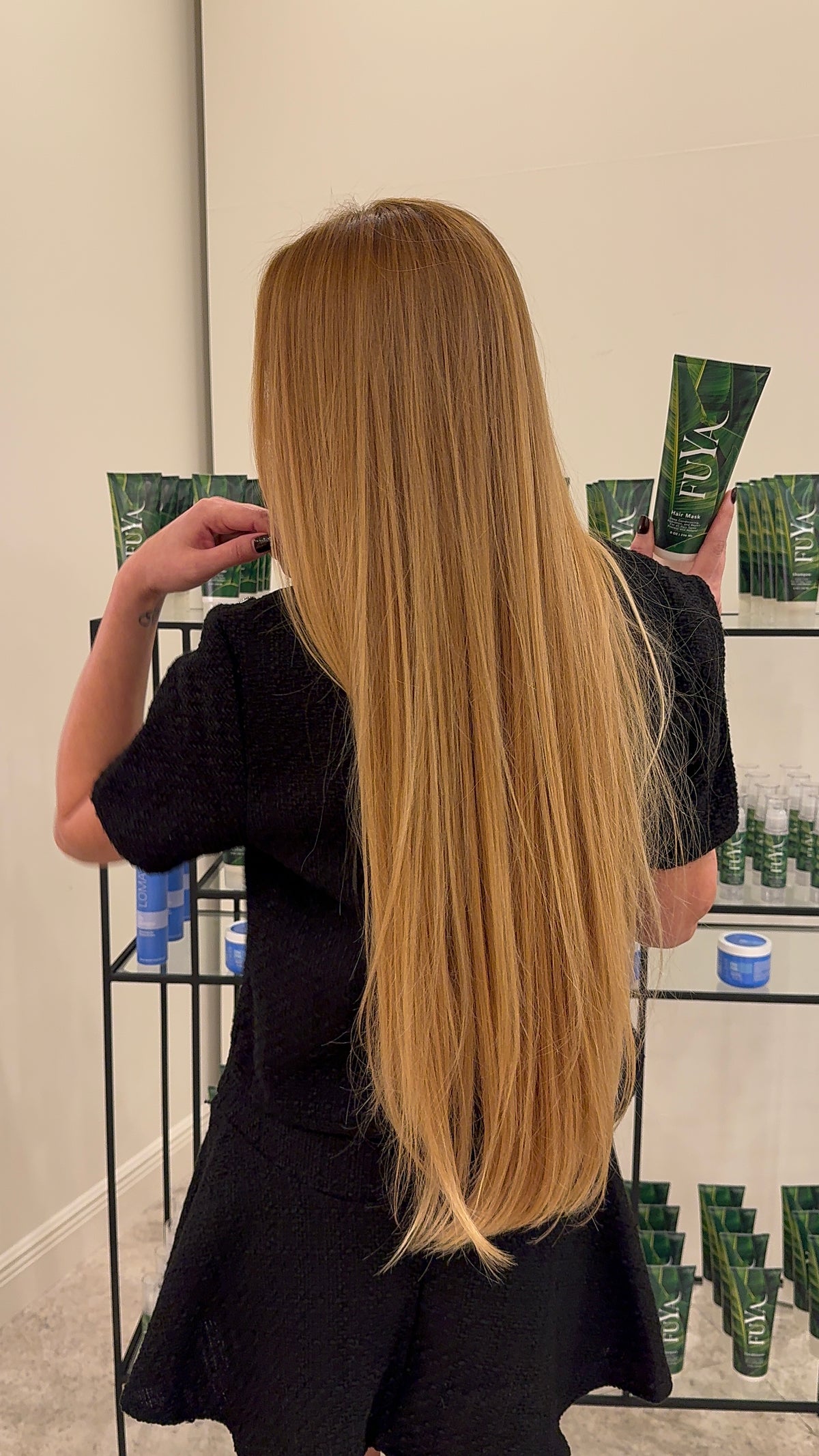 Very long, straight golden blonde hair, back view