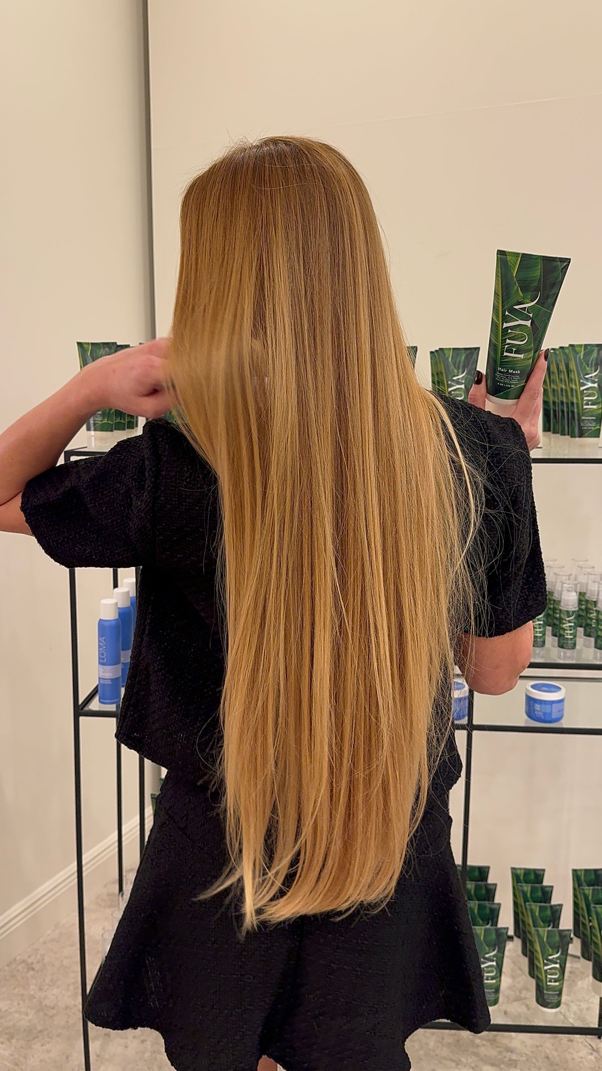 Very long golden blonde hair extensions, back view