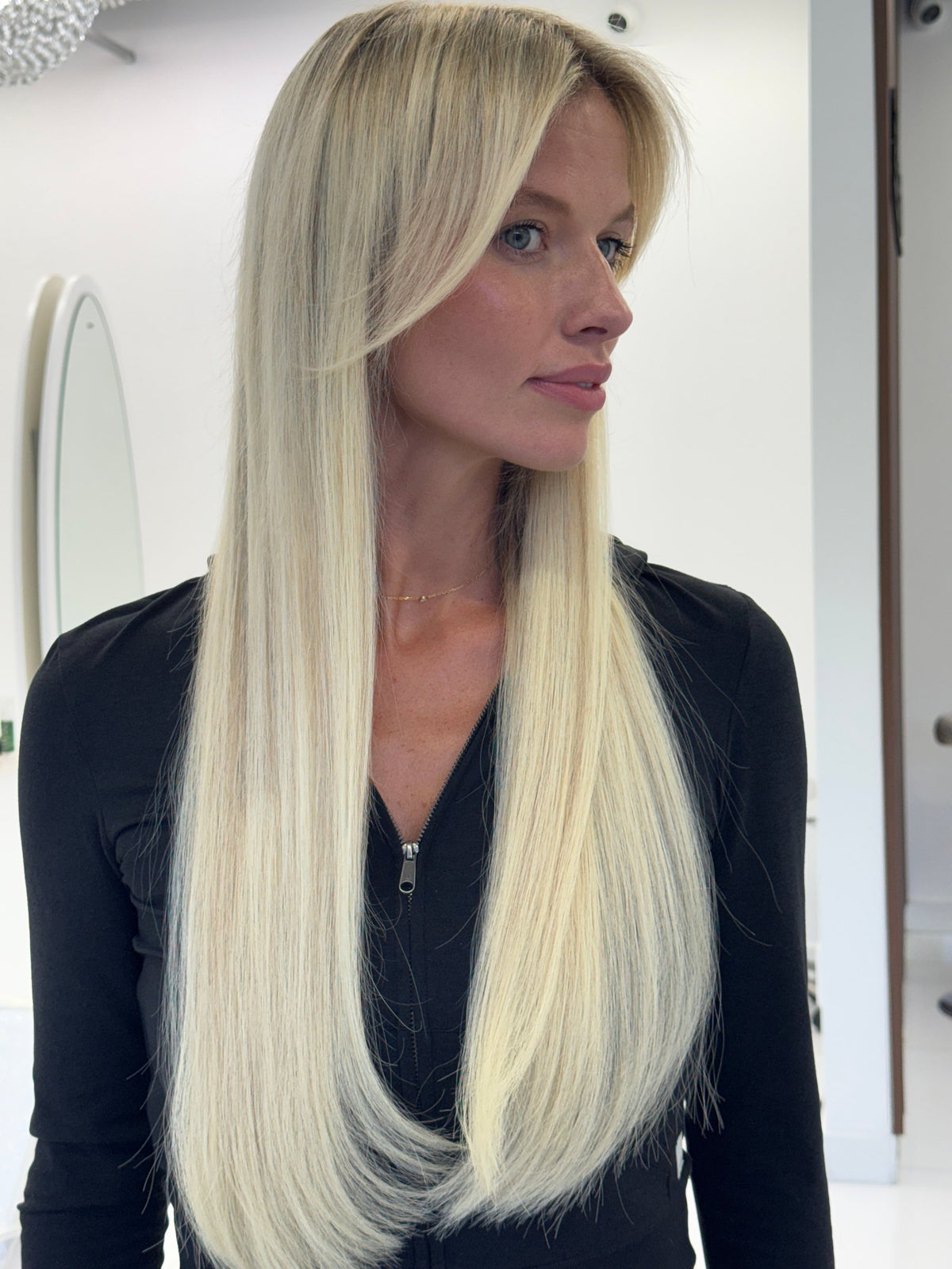 Long, sleek platinum blonde hair